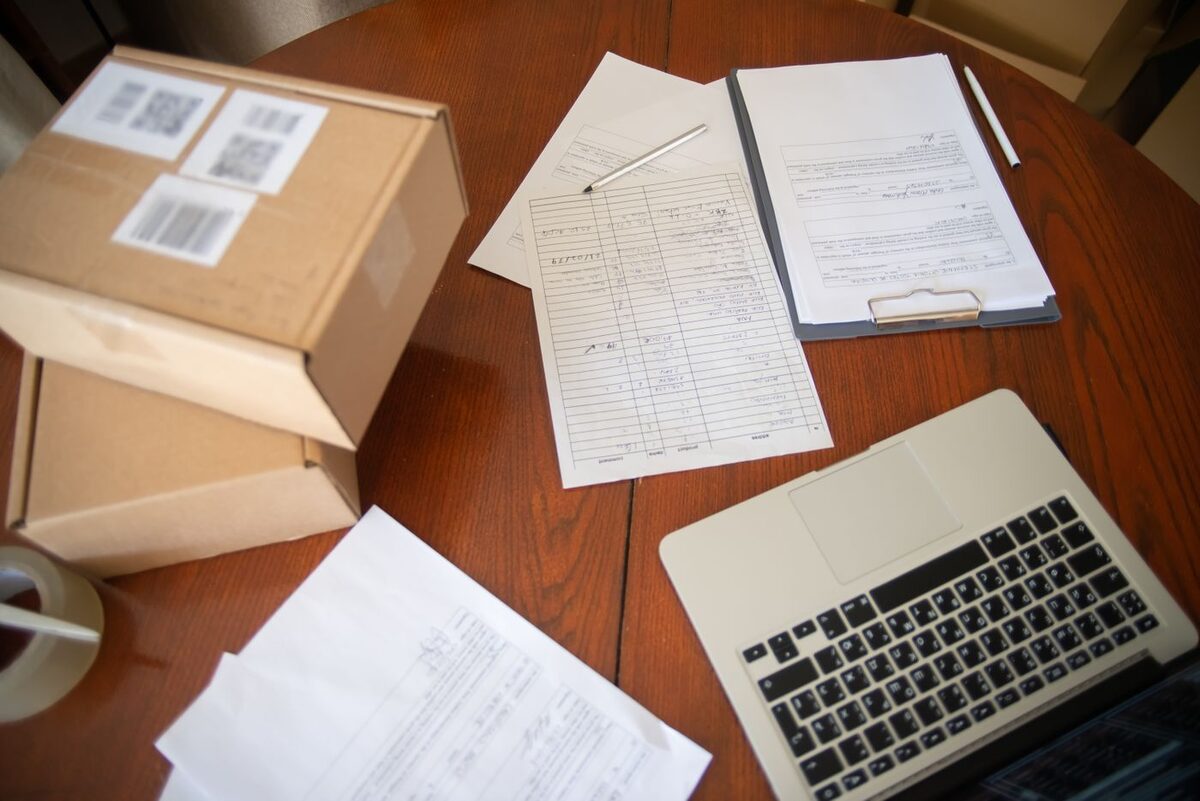Legal paperwork spread across a desk beside a laptop - paralegal document preparation services