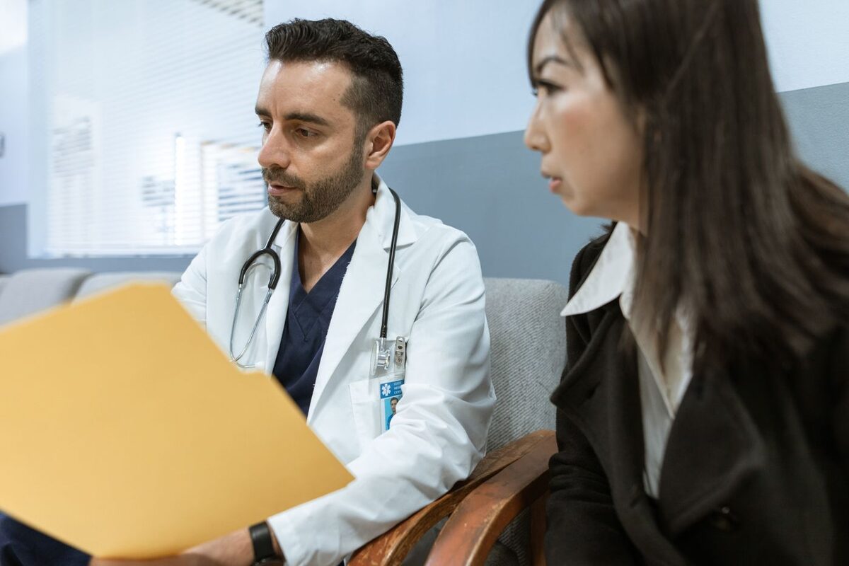Doctor reviewing a medical file with a family member - medical conservatorship authority