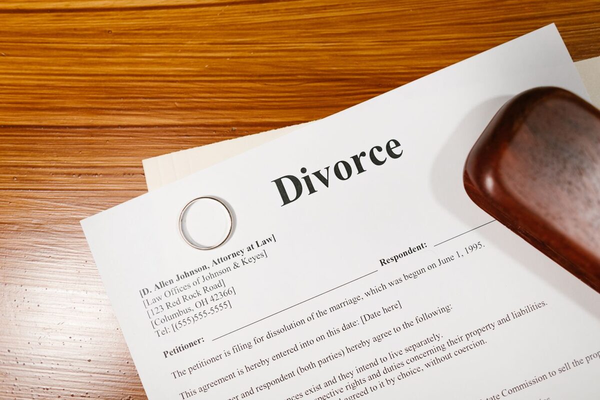 Divorce petition paperwork on a desk with a pen - filing your own divorce in Riverside County
